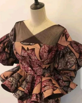 Traditional print dress -with see-through shoulders.